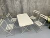 White Metal Folding Garden Table and Set of 4 Folding Chairs