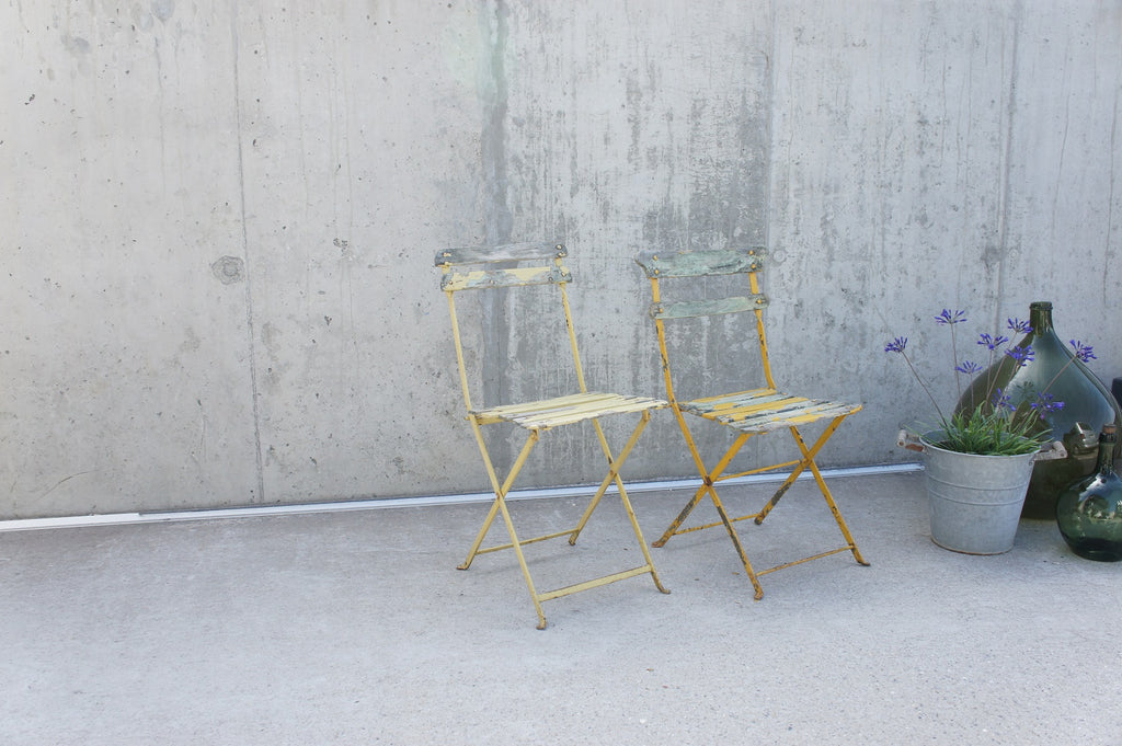 Two Yellow Painted Folding Bistro Chairs