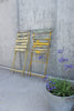Two Yellow Painted Folding Bistro Chairs